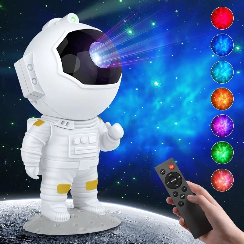 Astronaut-shaped projector lamp with vibrant galaxy effects, paired with a remote control, complementing the theme of Foosball Table for Sale.