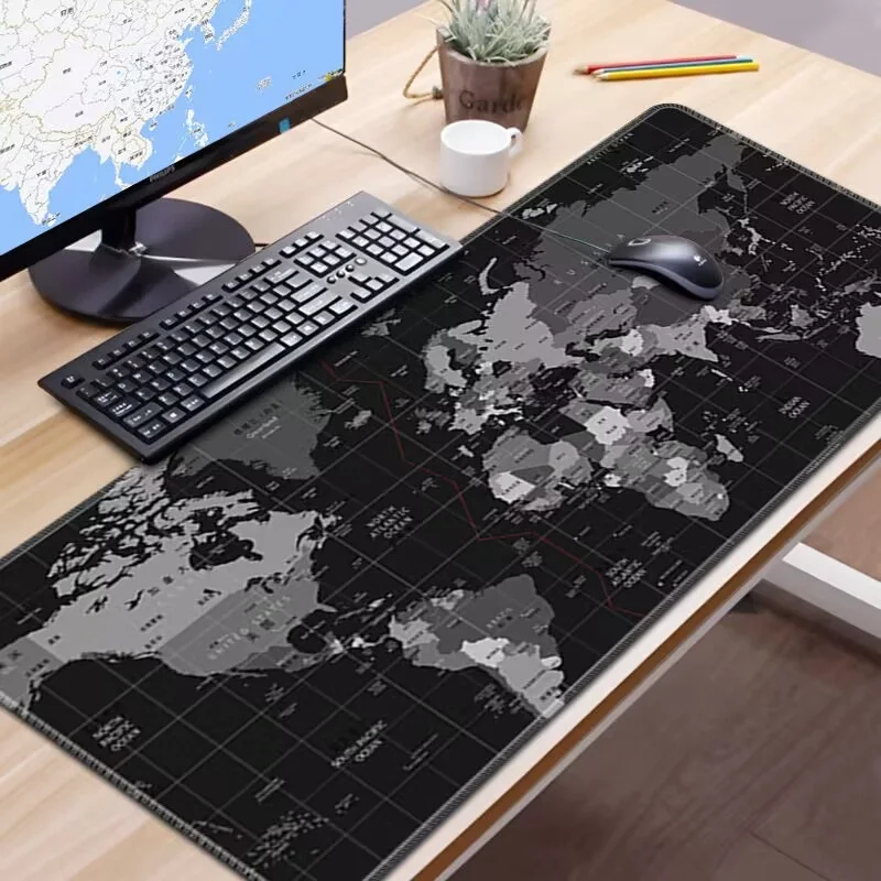 Desk setup with a world map mouse pad, ideal for complementing a hockey table area.