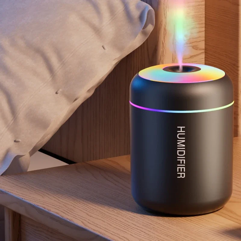 Compact RGB humidifier adds atmosphere to gaming rooms featuring foosball tables and tech.