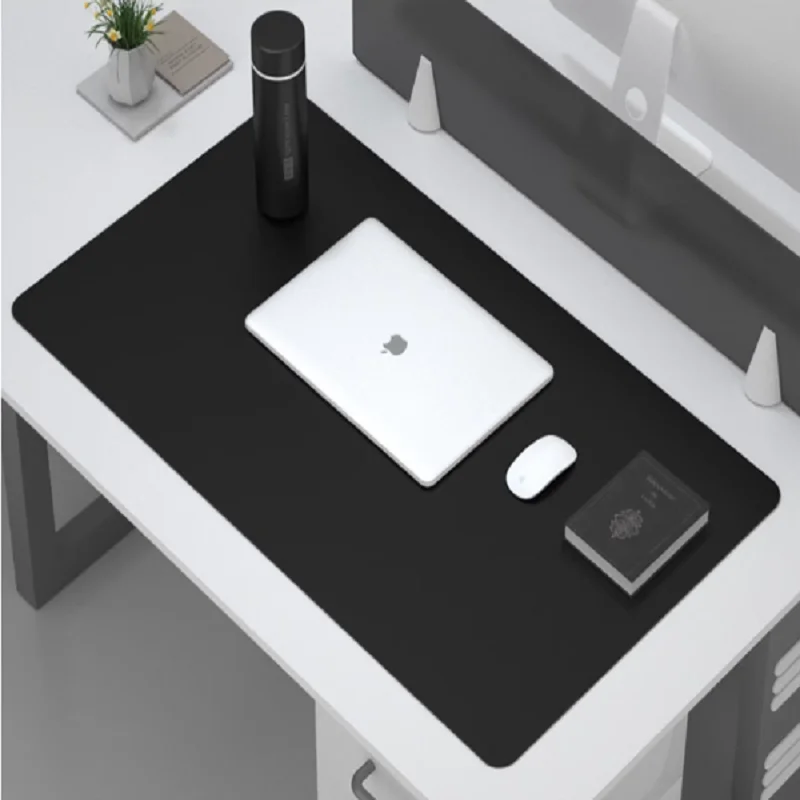 Sleek black desk mat enhances organization and comfort for any table in pub workspace.